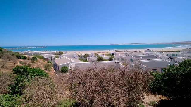 Lookout view over whitewashed cottages toward beach and ocean in Paternoster