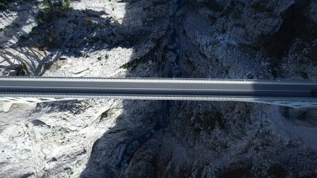 Car Travel Through Scenic Albanian Mountains Passing Over Iconic Rruga e Arbrit High Steel Bridge