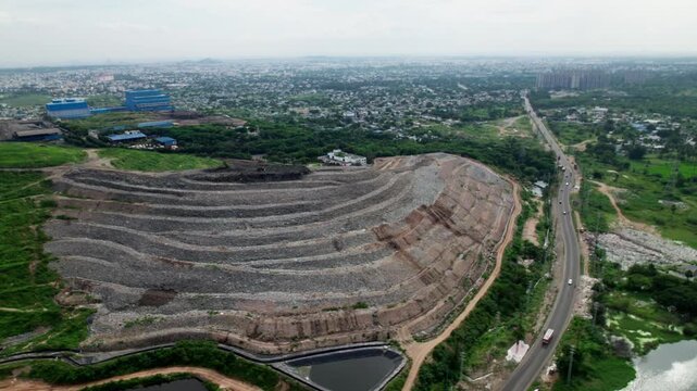 Aerial view of HIMSW Ltd with balaji nagar dumping yard and cityscape. hyderabad, telangana, india. day time, semi circle shot, drone shot, 4k.