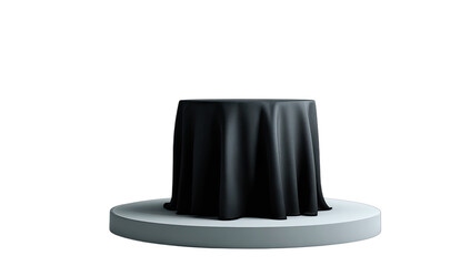 A dark fabric-covered cylinder sits on a white circular pedestal against a black background