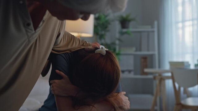 Asian elderly mother comforting upset daughter crying for life problem. 