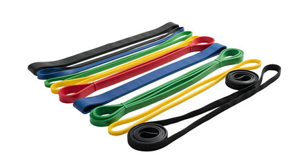 Different colors of resistance bands placed in a row on a plain background for fitness and exercise routines
