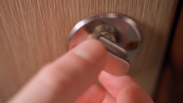 Opening a door lock from the inside, close-up