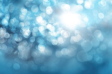 Fototapeta premium Beautiful abstract backdrop featuring soft light blue tones with sparkling bokeh effects, creating a serene atmosphere for creative projects and designs
