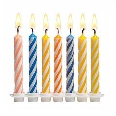 Seven birthday candles, striped in pastel colors, lit