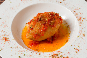 Traditional Turkish stuffed meatballs served with rich tomato sauce