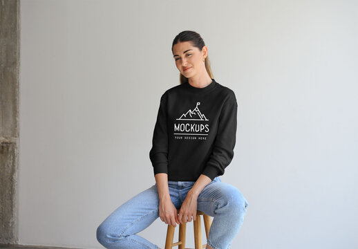 Mockup Of Woman Wearing Customizable Sweatshirt On Stool