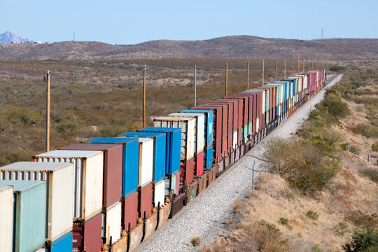 Container stack train receding into the distant landscape