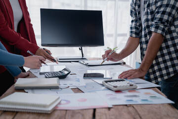 Business team analyzing financial data and planning strategy