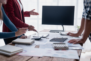 Business team collaborating on financial data analysis