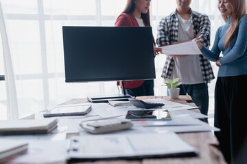 Business team discussing documents in a modern office