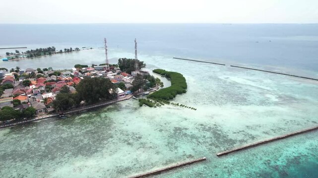 Coastal area of Pulau Pramuka in the Thousand Islands, featuring tropical shoreline, clear sea, and island ecosystem.