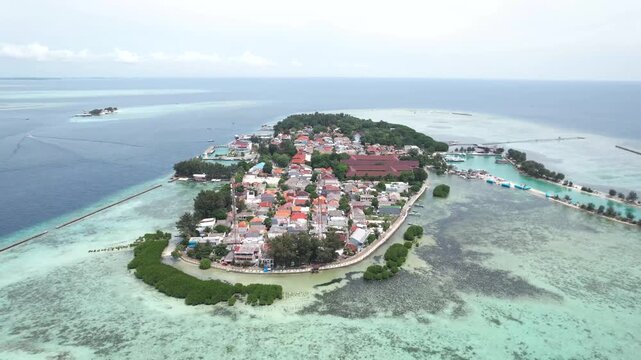 Coastal area of Pulau Pramuka in the Thousand Islands, featuring tropical shoreline, clear sea, and island ecosystem.