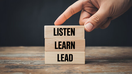 Inspirational leadership concept with wooden blocks