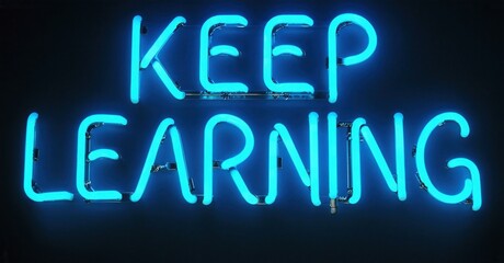 Bright blue neon sign displays words keep learning against dark background. Simple message promotes education, growth.