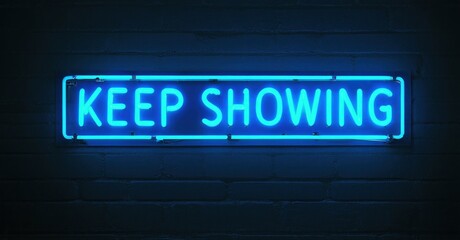 Fototapeta premium Bright blue neon sign displays text KEEP SHOWING against dark brick wall. Simple rectangular design, glowing illumination.