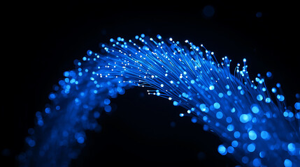 Blue glowing fiber optic cables forming an arc on dark background