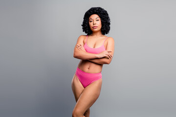 Confident young woman in pink bikini pose for beauty lifestyle fashion advertising