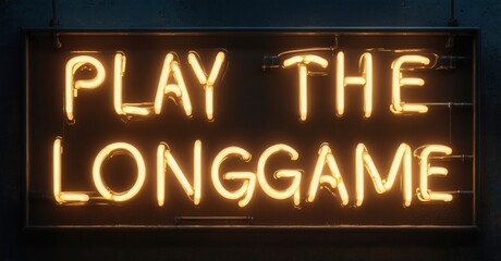 Obraz premium Bright neon sign displays text. Words Play The Longgame glow against dark background. Simple, motivational message.