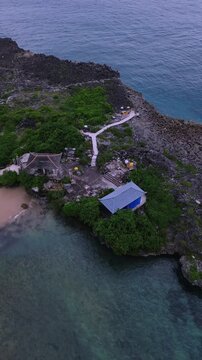 Aerial Drone View Path Leading To Balines temple, Stone Walkway Branches Into,Nusa Dua, Bali,Indonesia,Vertical video