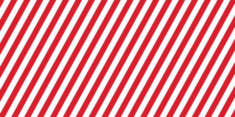 Obraz premium Striped candy cane seamless pattern with red and white diagonal stripes background, ideal for Christmas or New Year decoration, Xmas gift wrap, winter holiday packaging, and present wrapping paper des