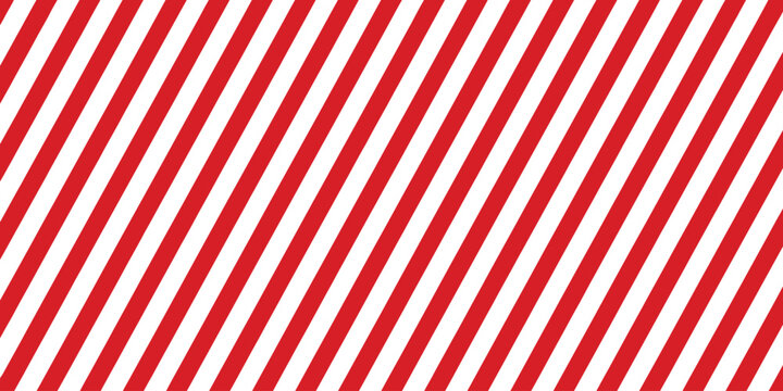 Striped candy cane seamless pattern designed for Christmas and New Year decoration, with classic red and white diagonal stripes background, seasonal winter theme, and festive gift wrapping paper use.