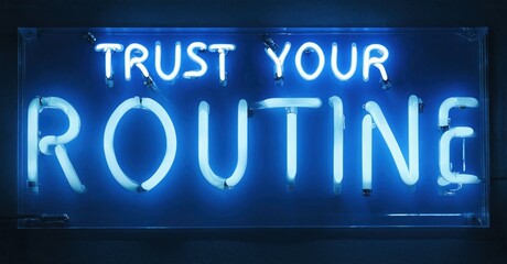 Fototapeta premium Bright neon sign displays text. Blue glow illuminates words against dark background. Minimalist aesthetic, simple message.