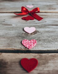 Fototapeta premium Valentine's Day. presents, heart felt and decor on wooden background 05.jpg, Valentine's Day. presents, heart felt and decor on wooden background 