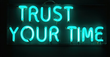 Fototapeta premium Bright neon sign displays positive message. Turquoise glow contrasts dark background. Simple typography, inspirational quote visible.
