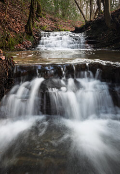 Small cascading waterfalls on the Dallington Stream in Dallington Forest on the high weald in east Sussex south east England UK