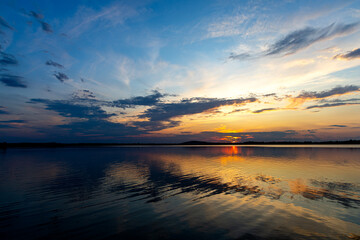 Obraz premium Dramatic summer sunset over Lake Mitkow in Poland. Evening landscape.