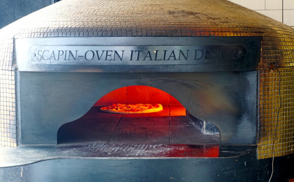 Chonburi, Thailand - August 26, 2025 : Wood-fired and gas-fired pizza ovens fix pipe at wall on 26 August 2025 in Pattaya city, Chonburi, Thailand