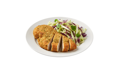 Crispy chicken breast served with shredded cabbage on a white plate against a white backdrop