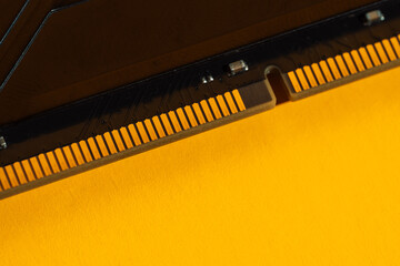 Row of RAM memory modules on bright yellow background. High quality photo