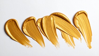 Metallic Gold Brushstrokes &ndash; Glossy Textured Paint Streaks on White Surface