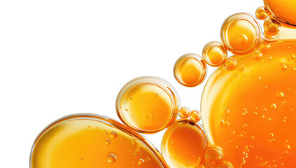 Close-up of luminous golden spheres and bubbles against a dark backdrop