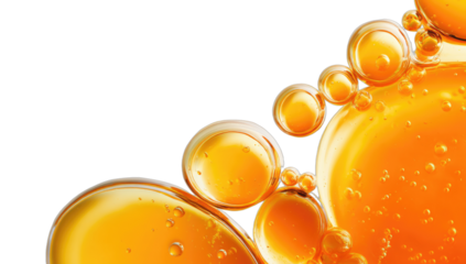 Close-up of luminous golden spheres and bubbles against a dark backdrop