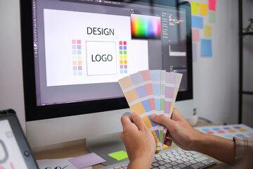 Creative Professional Actively Selecting Color Palette For New Brand Logo