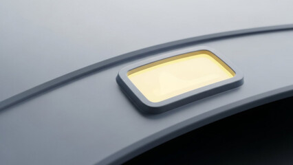 Modern illuminated button on sleek gray surface