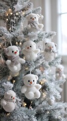 Obraz premium Adorable plush bear ornaments hanging on a festive snowy christmas tree
