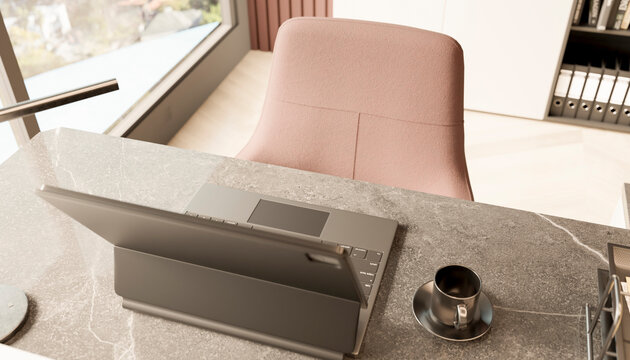 Modern office desk setup with laptop and coffee cup in natural light