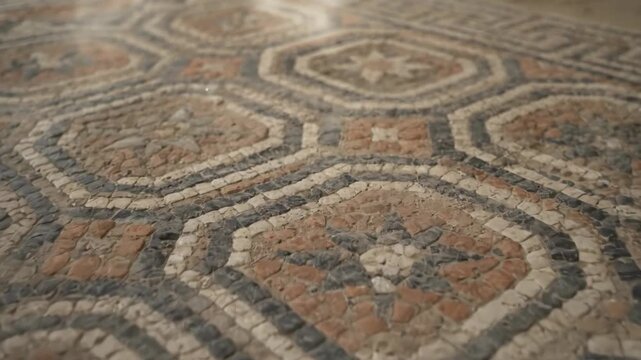 Ancient mosaic floor with geometric pattern in an archaeological site revealing old art and design