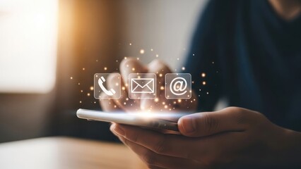 Hands holding smartphone with glowing digital contact icons displayed.