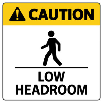 Yellow caution sign warning of low headroom for pedestrians