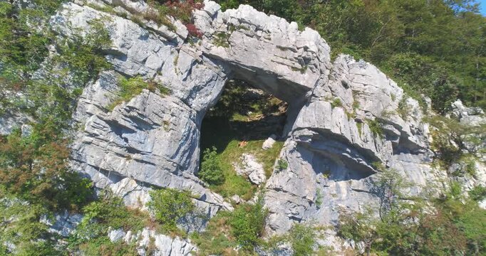 Aerial view of stone arch and canyon landscape, Slovenia