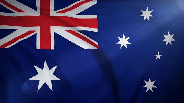Close-up view of the Australian national flag waving proudly, showcasing its blue field, Union Jack, Commonwealth Star, and Southern Cross constellation.