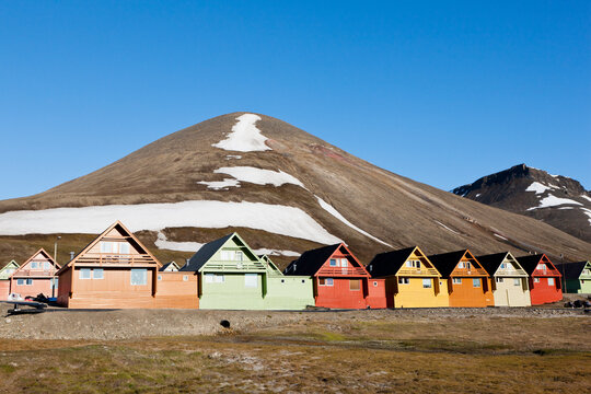 Colorful houses beneath mountain in Longyearbyen Svalbard Norway