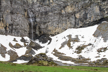 High mountain waterfall in Klausen Pass, Switzerland