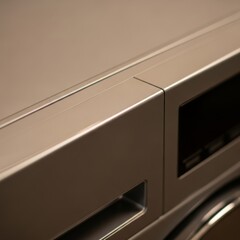 Minimalist product photography of a sleek unbranded washing machine featuring a smooth metallic surface and soft highlights.