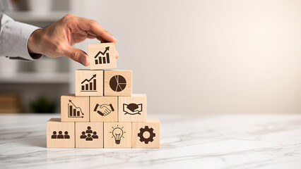 Business strategy growth success planning management teamwork leadership innovation business hand stacking wooden block pyramid showing growth